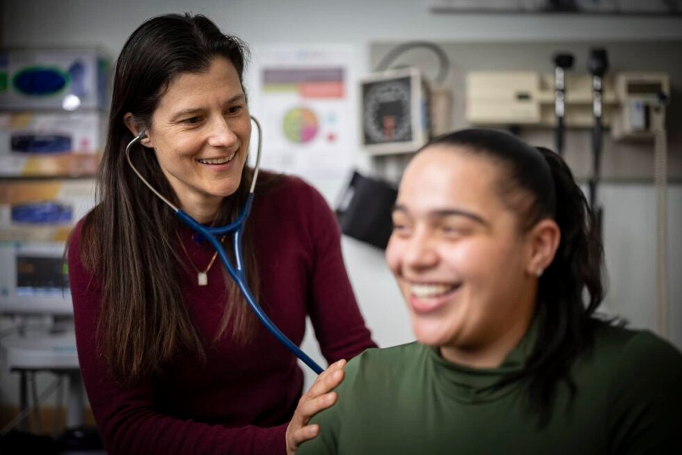 A doctor examines a patient