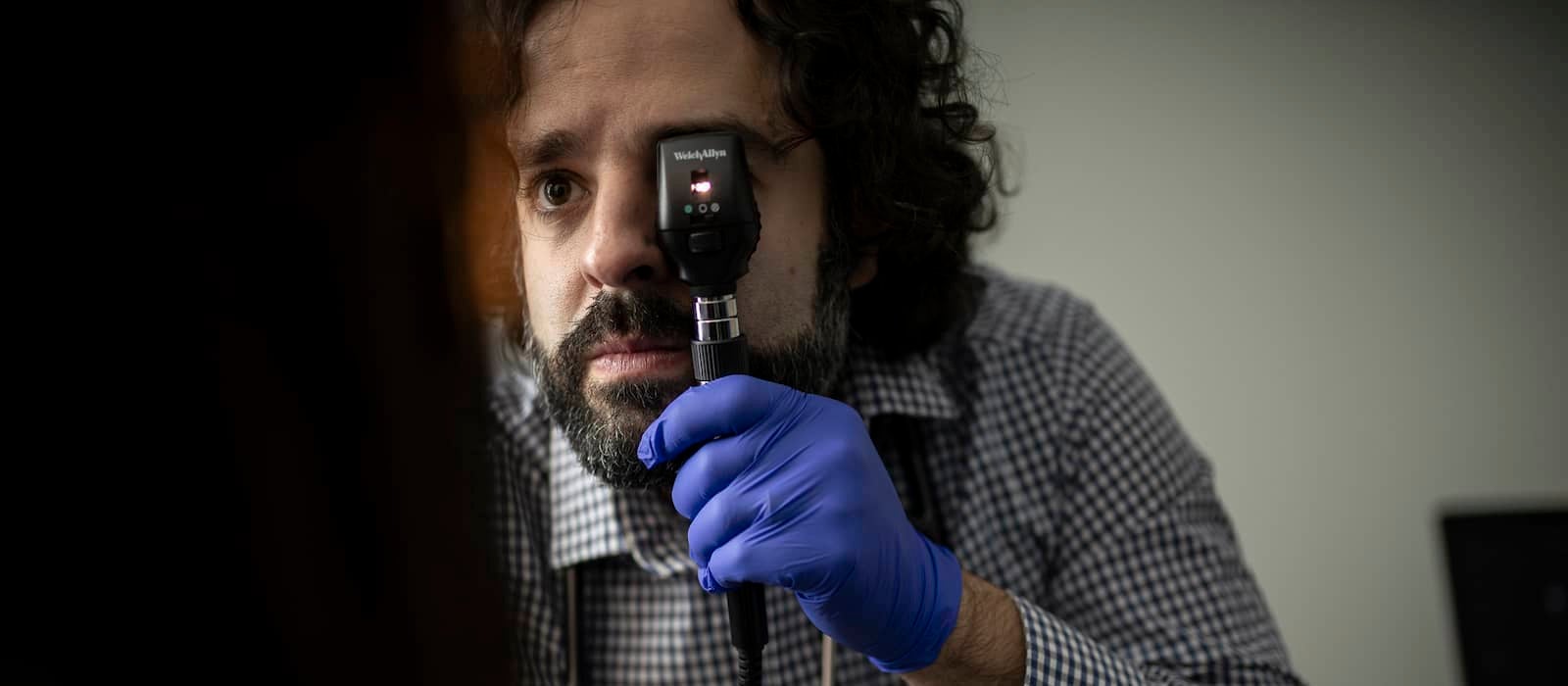 Doctor examines eye