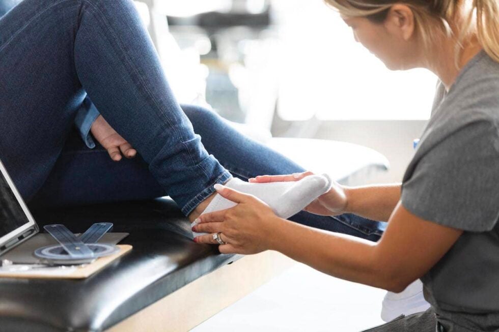 Doctor examines foot