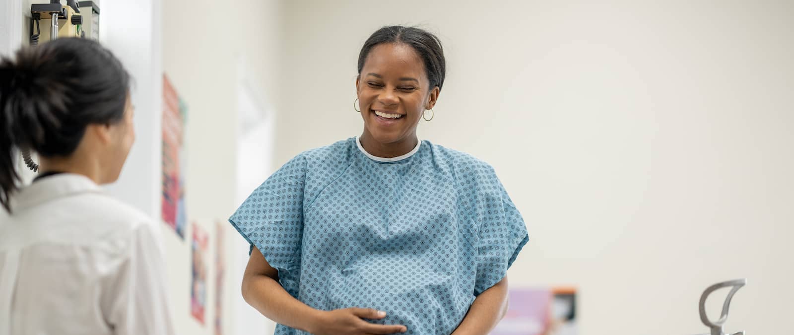 Pregnant person in gown